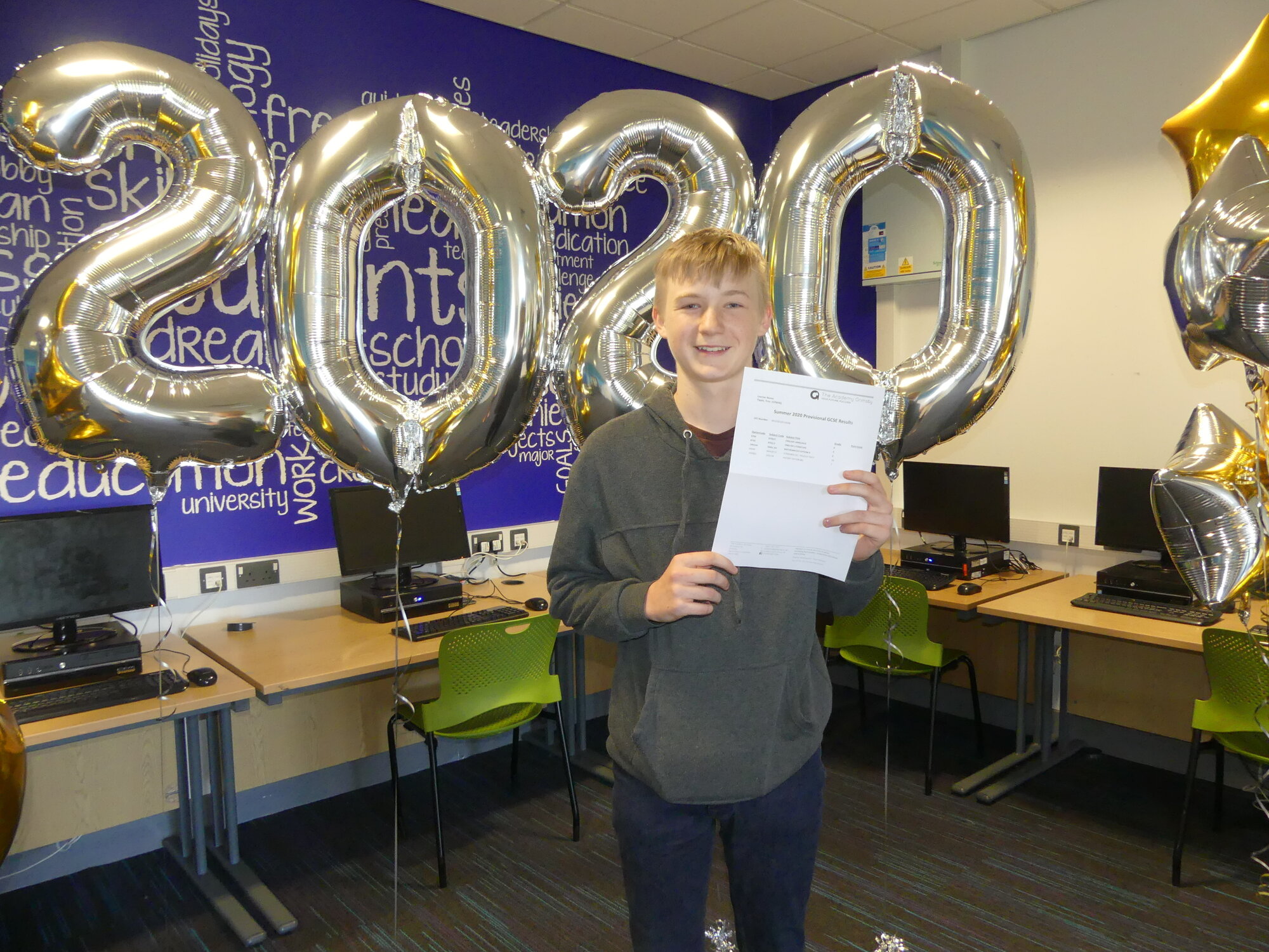 troy centre stage receiving his gcse results at the academy grimsby